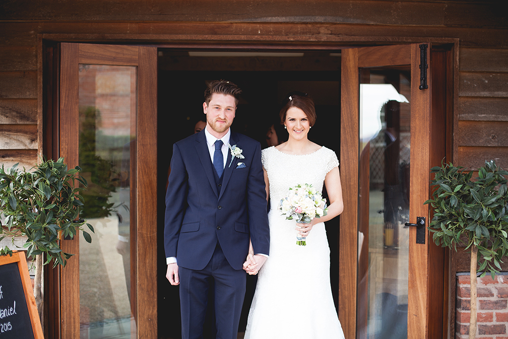 Bride and groom leaving Sandhole Oak Barn