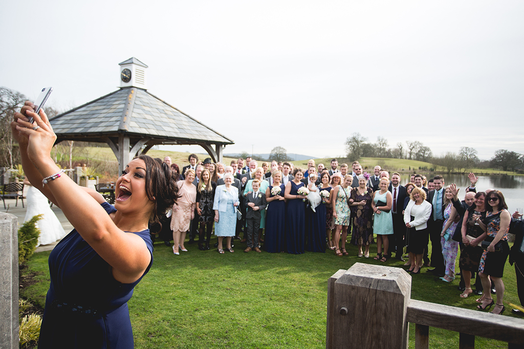 Family celebrating outside of Sandhole Oak Barn