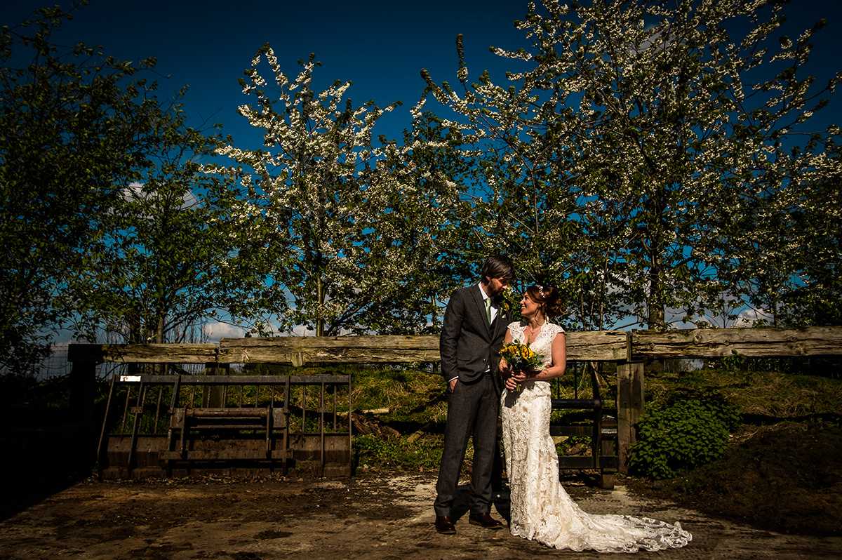 A happy couple stealing a moment at Sandhole Oak Barn